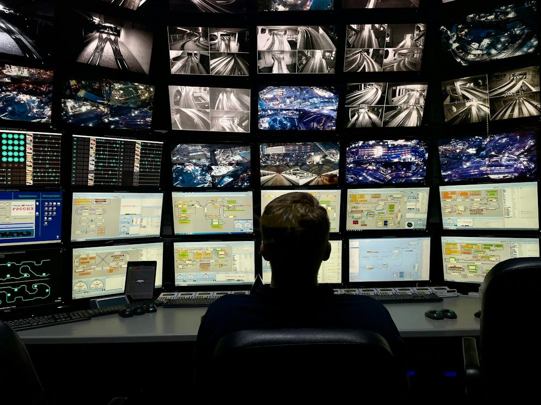 Home a-man-sitting-in-front-of-multiple-monitors-ttmkq3ljm-u