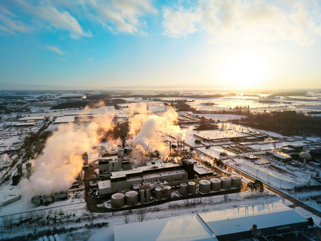 Home industrial-complex-emitting-steam-on-a-snowy-day-rkpo1stedk0
