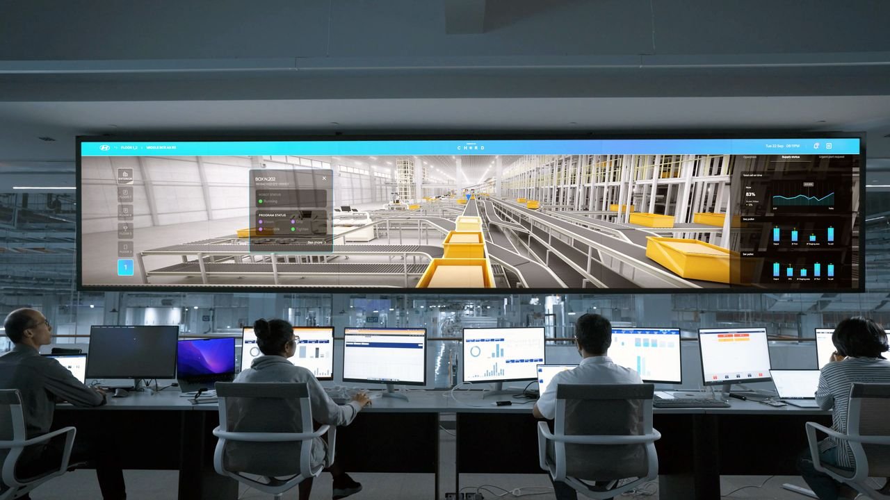 Home Modern control room with people monitoring large digital displays and computer systems.